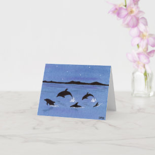 Cartão de golfinhos divertidos