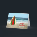 Cartão de Natal com as prancha na praia<br><div class="desc">Este é um cartão do divertimento que eu crie com algumas prancha brilhantes e coloridas empilhadas como uma árvore de Natal na praia com uma estrela do mar na parte superior e o oceano atrás dele. Todo o texto na parte dianteira e na parte traseira do cartão é customizável assim...</div>