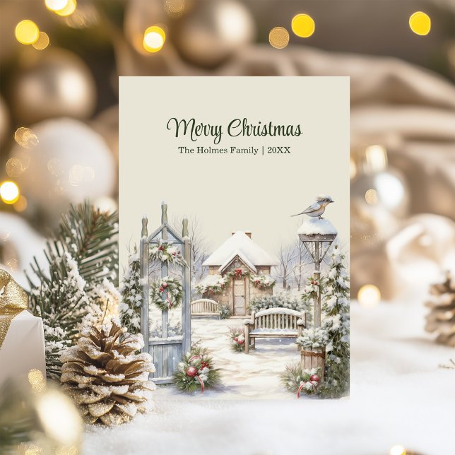 Cartão de Natal da Porta de inverno - Cena de Algo (Winter Gate Christmas Card – Snowy Cottage Scene on a table with Christmas decor and lights.)