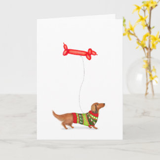 Cartão de Natal de Dachshund com balão de cachorro