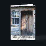 Cartão de Natal rústico do país da cabana rústica<br><div class="desc">Uma porta de cabana rústica de madeira rústica, decorada com uma meia primitiva dá boas-vindas à época natalícia. O verso interno deseja um Natal antiquado do país. Você pode facilmente mudar o verso para dentro ou a licença como é. Apenas adicione sua família ou informação do negócio. Muito Prim! Excelente...</div>