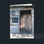 Cartão de Natal rústico do país da cabana rústica<br><div class="desc">Uma porta de cabana rústica de madeira rústica, decorada com uma meia primitiva dá boas-vindas à época natalícia. O verso interno deseja um Natal antiquado do país. Você pode facilmente mudar o verso para dentro ou a licença como é. Apenas adicione sua família ou informação do negócio. Muito Prim! Excelente...</div>