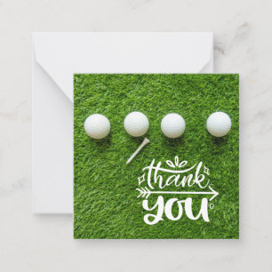 Cartão De Notas Bola de golfe com obrigado tanto na grama verde