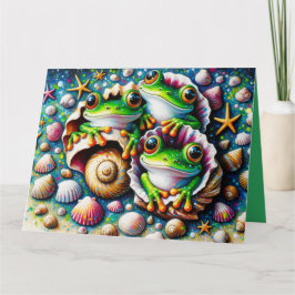 Cartão de saudação dobrado com três Sapos