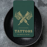 Cartão De Visita Artista De Tatuagem Dourada E Verde Da Vintage Min<br><div class="desc">Elevem sua marca com nossa Cartão de visita de Artista de Tatuagem Minimalista Verde e Dourada, projetada para o profissional de tatuagem discernível. Esta elegante carta vertical combina perfeitamente a estética ousada com uma abordagem minimalista, criando uma poderosa declaração de sua arte e profissionalismo. O cenário verde profundo expele sofisticação,...</div>