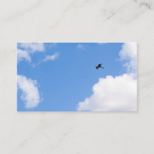 Cartão De Visita Solitary Bird Soaring Through Bright Blue Sky with