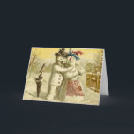 Cartão do boneco de neve e de Natal do snowwoman<br><div class="desc">Uma imagem do vintage de um boneco de neve e um snowlady,  um pisco de peito vermelho sentam-se no punho de um guarda-chuva. O casal está obviamente no amor</div>