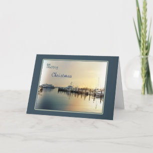 Cartão do Natal - barcos no nascer do sol do porto