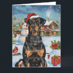 Cartão Doberman Winter Wonderland Christmas Joy<br><div class="desc">Este design festivo captura o espírito alegre da época de férias, apresentando um adorável filhote vestindo um chapéu de Papai Noel. O cachorro está aninhado numa terra maravilhosa de inverno, completo com um boneco de neve, uma árvore de Natal decorada, e presentes lindamente envoltos. Os flocos de neve caem suavemente,...</div>