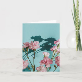 Cartão Dreamy pink carnation flowers on blue background