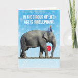 Cartão Foto De Elefante Engraçado - Idade É Aniversário I<br><div class="desc">Foto engraçada de um elefante vestindo um chapéu de festa,  segurando um balão com o porta-malas e andando sobre uma corda apertada. No circo da vida,  a idade é irrelevante,  a menos que você esteja em uma corda apertada,  então ajuda ser jovem. É verdade!</div>