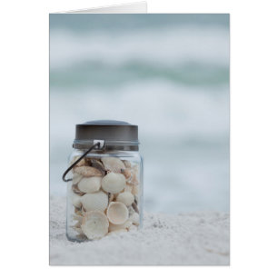 Cartão Frasco dos Seashells na praia Florida