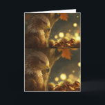 Cartão Golden Harvest Greetings<br><div class="desc">A quiet moment in the heart of autumn, captured in soft amber light. A golden eagle perches gracefully, its sharp gaze focused on a rustic pot brimming with chestnuts—some smooth, some still wrapped in spiny husks. A subtle glow emanates from within, illuminating the textures and casting gentle highlights across the...</div>