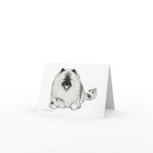 Keeshond com filhotes de cachorro