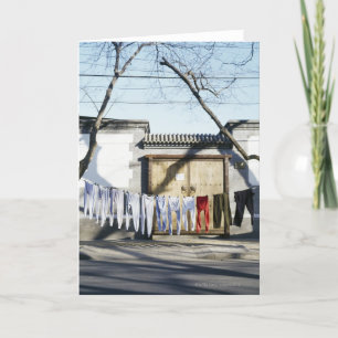 Cartão Laundry Drying on Clotheslines