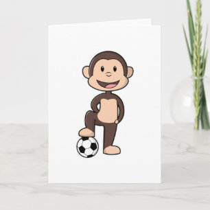 Cartão Macaco como jogador de futebol com bola de futebol