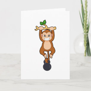 Cartão Macaco em treino de força com haltere