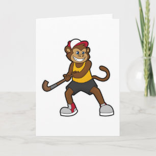 Cartão Macaco no hóquei com taco de hóquei