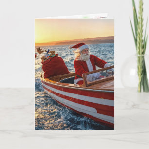 Cartão Papai Noel dirigindo um barco veloz