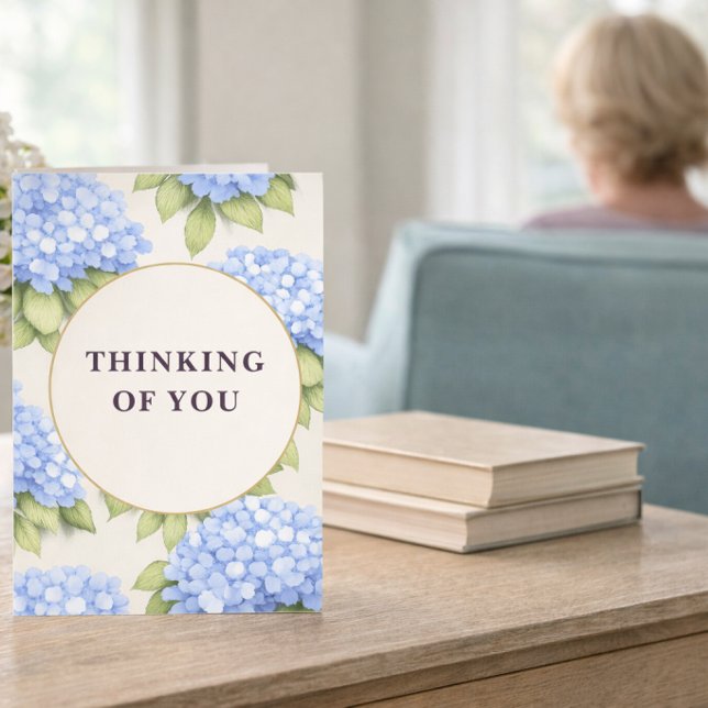 Cartão Pensando em Você - Hidrangea Azul Floral (Elegant blue hydrangea thinking of you card in a calm coastal setting, perfect for heartfelt moments)
