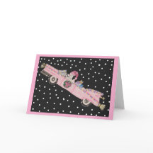 Poodle no Natal em um conversível rosa