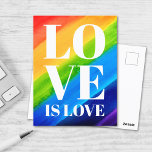 Cartão Postal Amor É Orgulho Arco-Íris<br><div class="desc">Este Cartão-postal Orgulho gay é decorado com LOVE IS LOVE em letras brancas em negrito num fundo arco-íris de cor d'água de vermelho,  laranja,  amarelo,  verde,  azul e roxo. Original Watercolor © Michele Davies.</div>