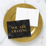 Cartão Postal As Luzes Do Chic Dark Bokeh Ficam Douradas Que Voc<br><div class="desc">Cartão postal motivacional chic com as palavras "Você é incrível" em folha de ouro falsa contra um fundo padrão de luzes escuras. Para adicionar texto ao cartão, clique no botão "Personalizar". *Observe que a Marca d'água do Zazzle que aparece na visualização de zoom NÃO aparecerá no produto impresso final. ©...</div>