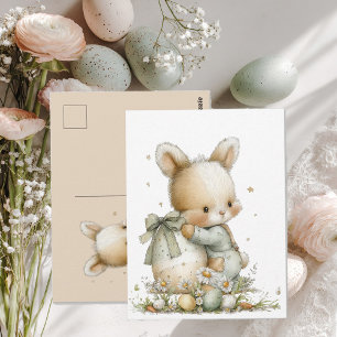 Cartão Postal Bebê coelho fofo de pijama com ovo de Páscoa