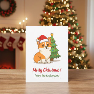 Cartão Postal Cachorro Corgi Fofo com um Chapéu Vermelho com Árv
