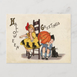 Cartão Postal Casal de crianças com abóbora esculpida, Halloween