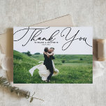 Cartão Postal Casamento de Fotos do Script Elegante Negro Obriga<br><div class="desc">Envie obrigados para a família e amigos com este obrigado de casamento personalizável que você fez. Ele tem um roteiro branco elegante. Personalize este elegante obrigado de casamento que você faz ao postcard adicionando seus próprios detalhes. Este obrigado de roteiro que você faz no postal também será perfeito para graduações,...</div>