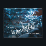 Cartão Postal De Festividades Árvore de Natal Azul Flat<br><div class="desc">Uma bela árvore de Natal coberta de neve reflete as luzes azuis da noite e apresenta "A época mais maravilhosa do ano" na frente e seu cartões de natal pessoal e nomes na parte de trás desses cartões postais de feriado.</div>