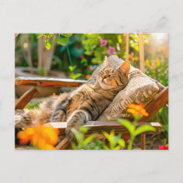 Cartão Postal De Festividades Cat sleeping in garden chair among flowers