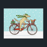 Cartão Postal De Festividades Feriado de inverno lunático do cão e do esquilo do<br><div class="desc">Cão bonito dos desenhos animados que veste um chapéu listrado verde do inverno e um lenço longo e que pedaling uma bicicleta vermelha. O esquilo vermelho alegre está montando na cesta da bicicleta. Estes dois estão em sua maneira de entregar presentes de Natal aos amigos. Este cartão animal lunático do...</div>