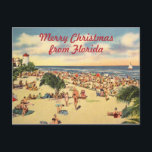 Cartão Postal De Festividades natais vintages Florida Beach Greeting<br><div class="desc">Cena de praia da Vintage na Flórida com texto personalizado: Feliz Natal da Flórida ou edite para as palavras de sua escolha. Ilustração antiga de cartão postal com muitas pessoas na praia,  palmeiras,  um farol e um veleiro armam o pano de fundo para um bom cartões de natal antiquado.</div>