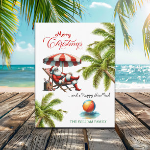 Cartão Postal De Festividades Natal com Papai Noel sob um Guarda-Chuva de Praia