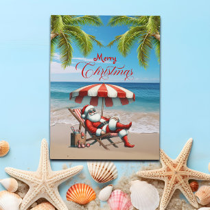 Cartão Postal De Festividades Natal do Papai Noel sob um Guarda-Chuva de Praia