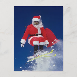 Cartão Postal De Festividades Santa Claus on skis jumping off a cornice at