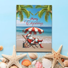 Cartão Postal De Festividades Santa under a Beach Umbrella Christmas