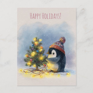 Cartão Postal De Festividades Small penguin decorates tiny Christmas tree,
