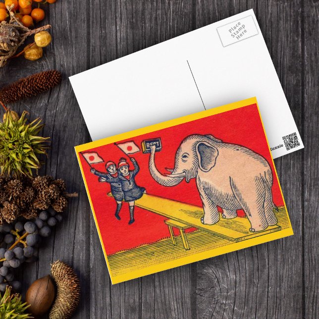 Cartão Postal Elefante sobre a gangorra com crianças de câmara (Elephant on seesaw with children waving Japanese flags on red and yellow postcard.)
