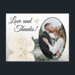 Cartão Postal Elegante Ivory White Rose Casando Amor e Obrigados<br><div class="desc">Este belo cartão postal é uma maneira simples, mas pensativa, de obrigado aos seus convidados de casamento. Ele apresenta uma design com sua foto de casamento em uma moldura oval, e um solteiro de marfim ou rosa branca, refletindo em uma piscina de água. A legenda diz "Amor e Obrigados" e...</div>