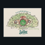 Cartão Postal Everything Grows in THE SHIRE™<br><div class="desc">Bring a little piece of Middle-Earth™ to your everyday with this charming Lord of the Rings™ design inspired by the cozy hills of Hobbiton. Featuring a storybook-style hobbit hole with its iconic round green door tucked into a lush hillside, the artwork is paired with the beloved phrase, “Everything grows in...</div>
