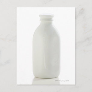 Cartão Postal Milk bottle on white background