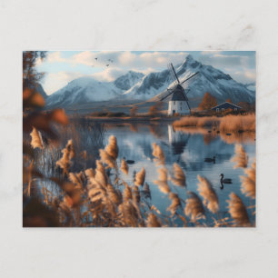 Cartão Postal Moinho de vento num lago com paisagem montanhosa