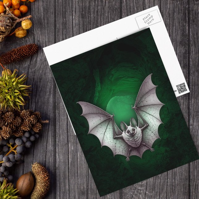 Cartão Postal Morcego Branco Sinistro Caverna Verde Brilhante no (Eerie flying white bat green glowing cave on black Halloween postcard.)