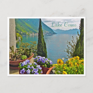 Cartão Postal Vista do Lago de Como através de flores em vasos