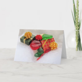 Cartão Presentes de Natal e vidro de mar