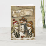 Cartão primitivo do Natal do boneco de neve<br><div class="desc">O cartão primitivo do Natal com um boneco de neve que reliaxing no céu nocturno com a neve lasca-se caindo.</div>