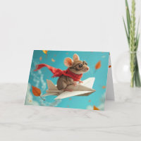 Rato de aniversário voando num avião de papel